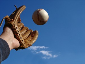BASEBALL GLOVE CATCHING BALL - BLUE SKY - iStock_000001344508XSmall
